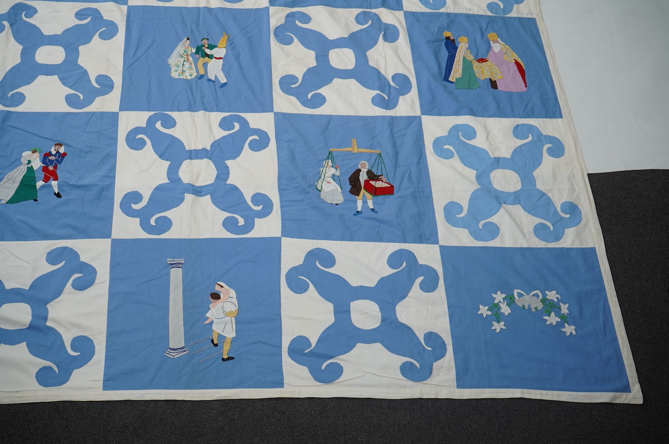 A rare figurative American ‘bridal quilt coverlet’, designed by Marion Cheever Whiteside Newton, whose designs were originally widely published in magazines and sold during the 1940’s-50’s. Her ‘quilting kits’ were also